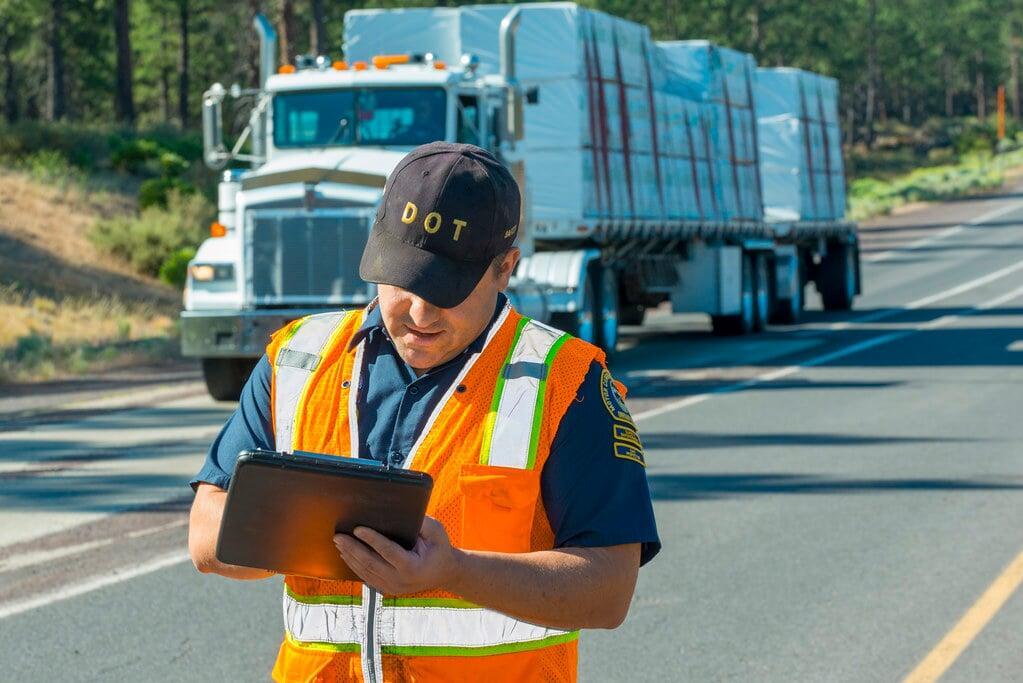 Truck stopped by DOT officer for DOT inspection